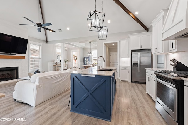 236 Whispering Meadows Rd, Broussard, LA 70518 - kitchen with appliances with stainless steel finishes, custom range hood, open floor plan, white cabinetry, and a chandelier