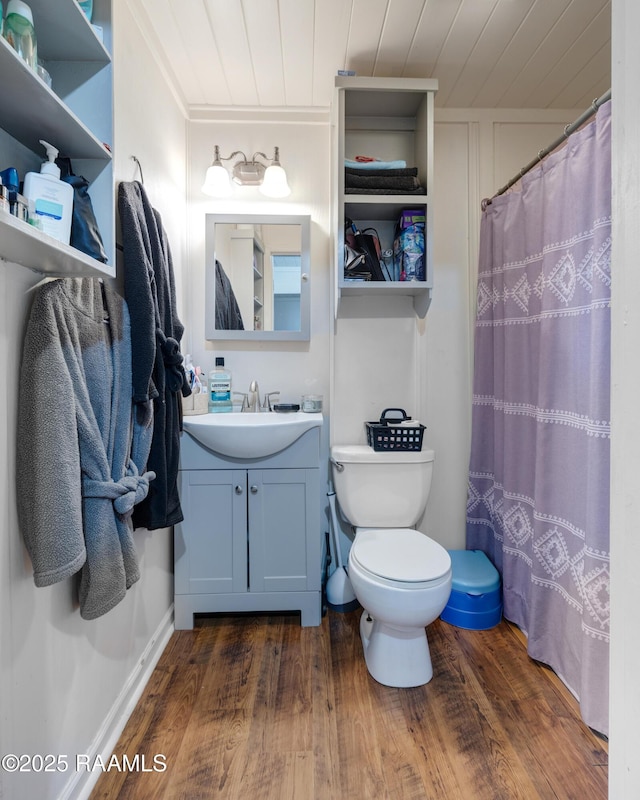 145 Celestine Ln, Sunset, LA 70584 - bathroom with wooden ceiling, wood finished floors, vanity, and a shower with shower curtain