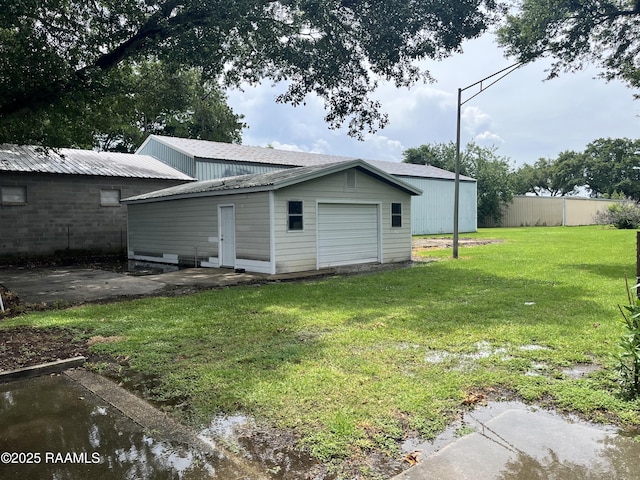 rear view of house with an outdoor structure