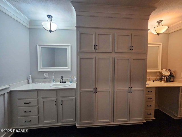 bathroom featuring crown molding and vanity