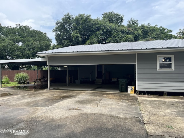 view of parking / parking lot with a carport and driveway