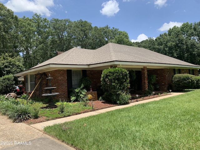 1921 E Willow St, Lafayette, LA 70501 - ranch-style home with a front yard and brick siding