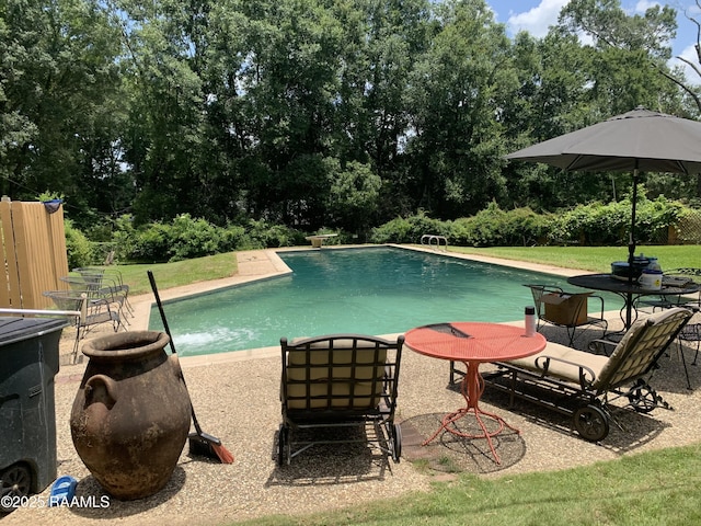 1921 E Willow St, Lafayette, LA 70501 - outdoor pool with view of scattered trees and a lawn