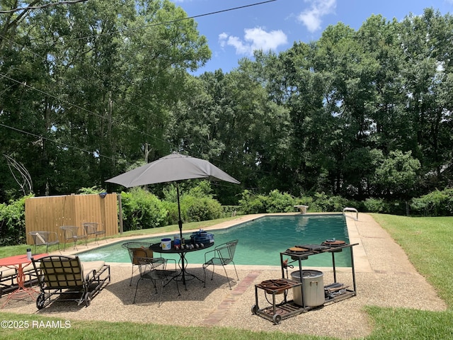 1921 E Willow St, Lafayette, LA 70501 - view of pool featuring a patio area and view of wooded area