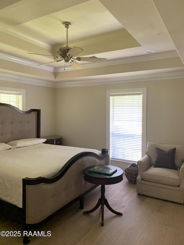 1921 E Willow St, Lafayette, LA 70501 - bedroom with a raised ceiling, wood finished floors, crown molding, and a ceiling fan