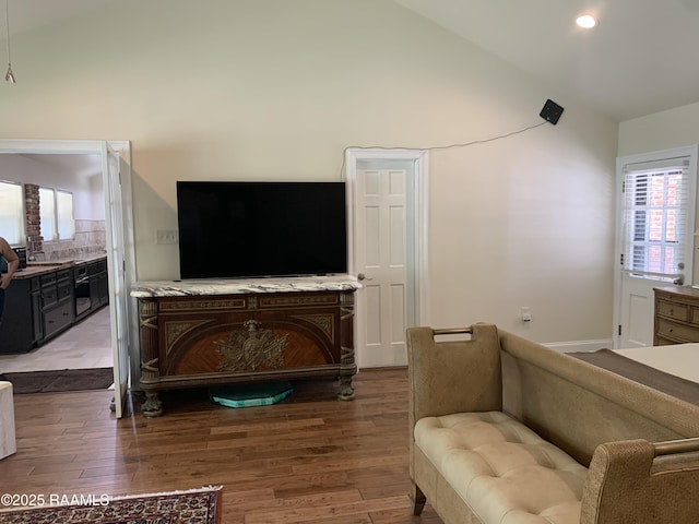 1921 E Willow St, Lafayette, LA 70501 - living area with wood finished floors, healthy amount of natural light, high vaulted ceiling, and recessed lighting