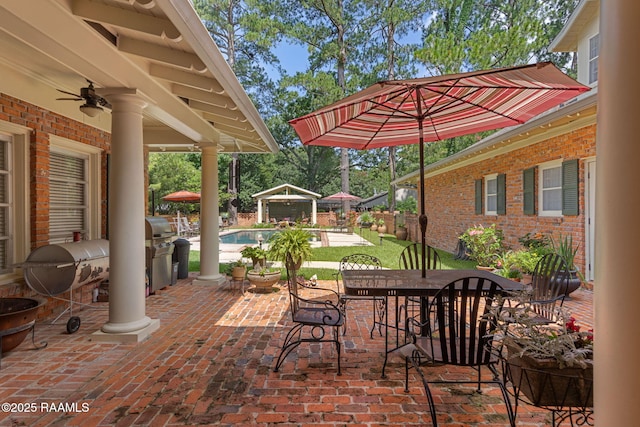 313 Darby Ln, New Iberia, LA 70560 - view of patio featuring a ceiling fan, outdoor dining area, and a grill