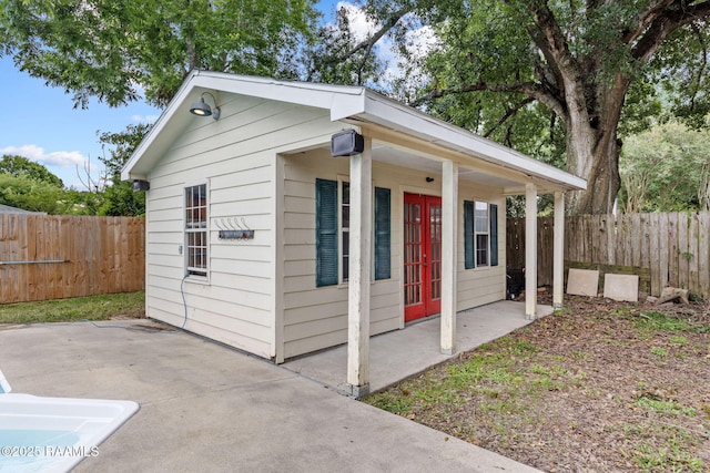 301 Broadmoor Blvd, Lafayette, LA 70503 - view of outbuilding featuring french doors and a fenced backyard