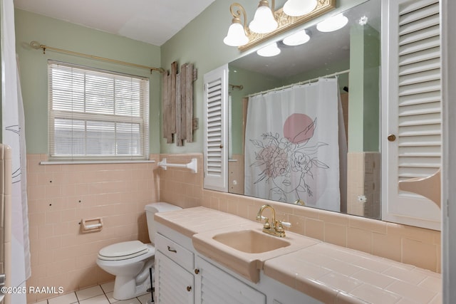 301 Broadmoor Blvd, Lafayette, LA 70503 - bathroom featuring vanity, tile walls, tile patterned flooring, wainscoting, and a shower with shower curtain