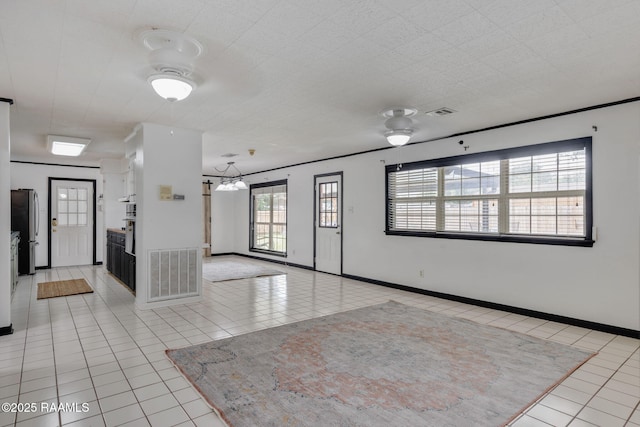 301 Broadmoor Blvd, Lafayette, LA 70503 - tiled spare room with ceiling fan and a chandelier