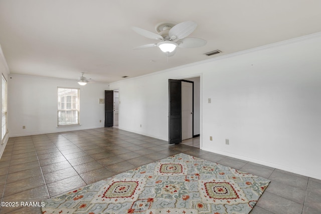 301 Broadmoor Blvd, Lafayette, LA 70503 - tiled spare room with a ceiling fan and crown molding