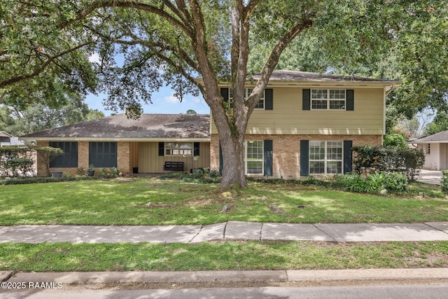 301 Broadmoor Blvd, Lafayette, LA 70503 - view of front facade featuring brick siding and a front lawn
