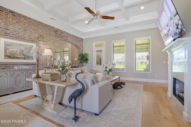 121 Snapping Ln, Broussard, LA 70518 - living room featuring a high end fireplace, ceiling fan, light wood-style flooring, coffered ceiling, and beam ceiling