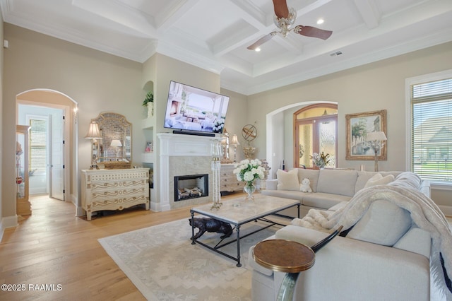 121 Snapping Ln, Broussard, LA 70518 - living area featuring arched walkways, coffered ceiling, a ceiling fan, beam ceiling, and ornamental molding