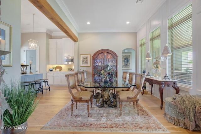 121 Snapping Ln, Broussard, LA 70518 - dining room featuring a chandelier, light wood-type flooring, ornamental molding, recessed lighting, and arched walkways