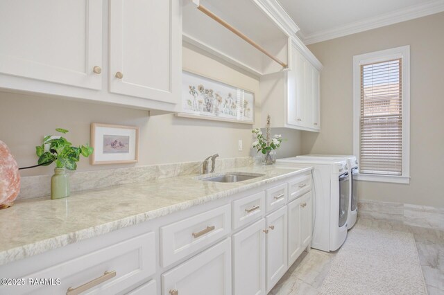 121 Snapping Ln, Broussard, LA 70518 - laundry area featuring washing machine and dryer, cabinet space, and crown molding