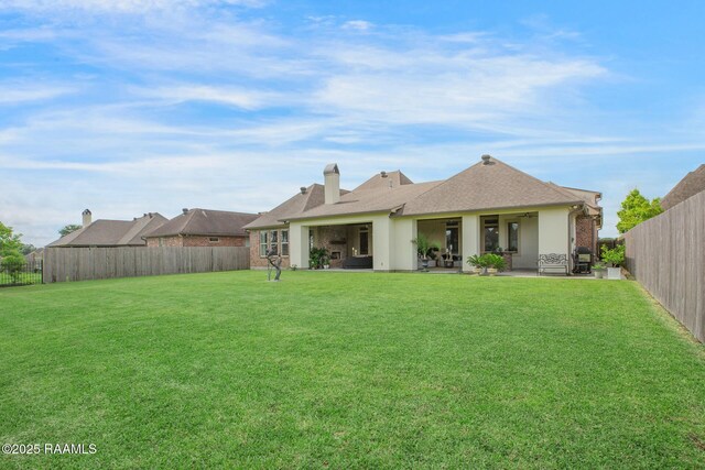 121 Snapping Ln, Broussard, LA 70518 - rear view of house featuring a fenced backyard, a patio area, roof with shingles, and stucco siding