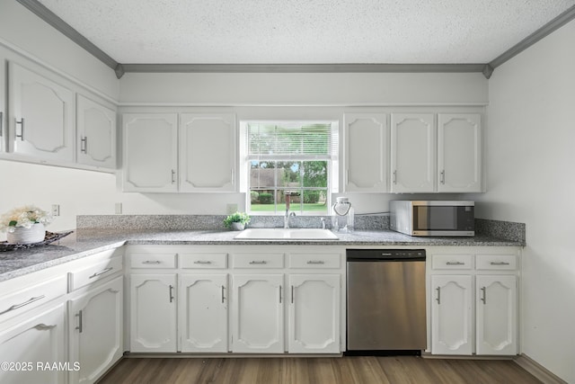 301 Estainville Ave, Lafayette, LA 70508 - kitchen with stainless steel appliances, a textured ceiling, white cabinetry, dark wood-style floors, and crown molding