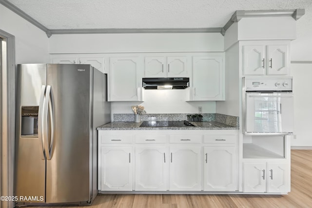 301 Estainville Ave, Lafayette, LA 70508 - kitchen with stainless steel fridge with ice dispenser, white oven, black electric stovetop, under cabinet range hood, and a textured ceiling
