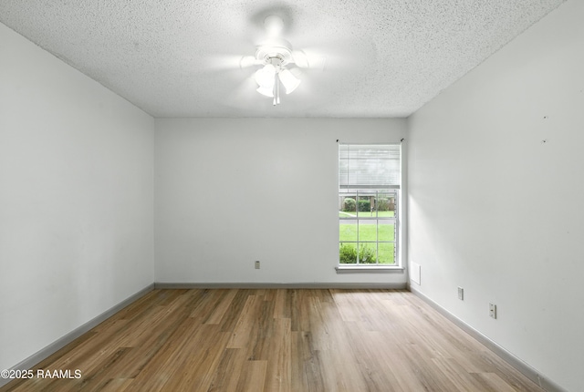 301 Estainville Ave, Lafayette, LA 70508 - unfurnished room featuring wood finished floors, a ceiling fan, and a textured ceiling