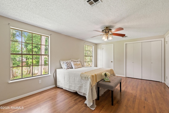 110 Shipley Dr, Lafayette, LA 70508 - bedroom featuring wood finished floors, a textured ceiling, and ceiling fan