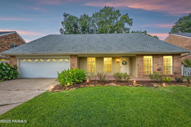 110 Shipley Dr, Lafayette, LA 70508 - view of front of house with a shingled roof, brick siding, and driveway
