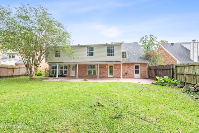 110 Shipley Dr, Lafayette, LA 70508 - back of house featuring a patio area, brick siding, and a fenced backyard