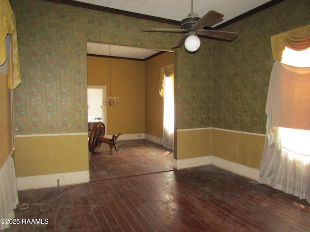 120 W Saint Peter St, New Iberia, LA 70560 - unfurnished room with wallpapered walls, hardwood / wood-style floors, wainscoting, ornamental molding, and a ceiling fan