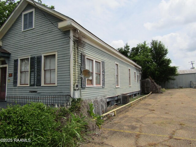 120 W Saint Peter St, New Iberia, LA 70560 - view of side of home with a cooling unit