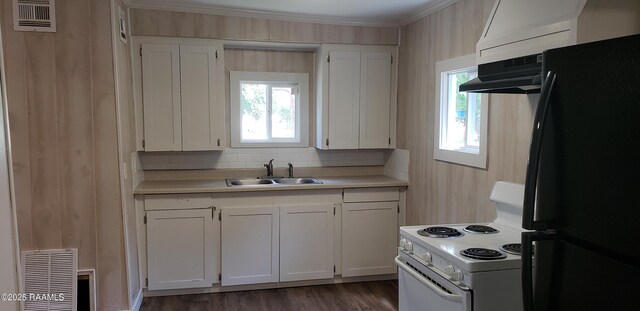 1814 E Lafayette St, Abbeville, LA 70510 - kitchen featuring freestanding refrigerator, white electric range, light countertops, white cabinets, and ornamental molding
