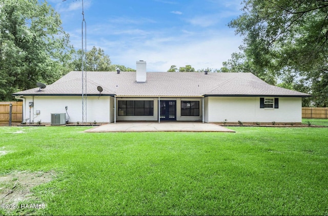 381 Rue Dauphine, Eunice, LA 70535 - back of property featuring a patio, a chimney, and brick siding