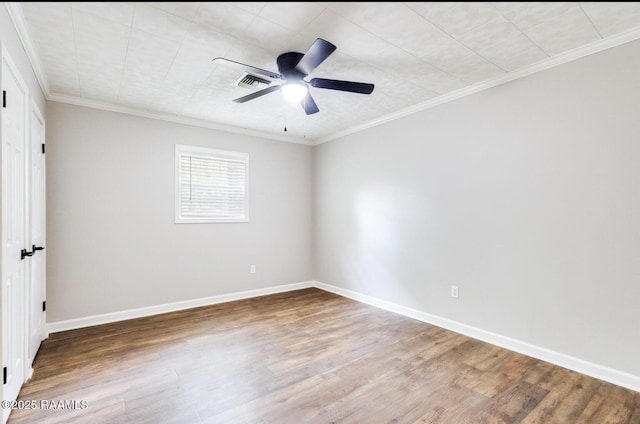 381 Rue Dauphine, Eunice, LA 70535 - empty room with wood finished floors, a ceiling fan, and ornamental molding