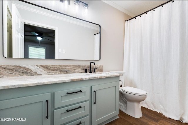 381 Rue Dauphine, Eunice, LA 70535 - full bathroom with ornamental molding, vanity, wood finished floors, and a ceiling fan