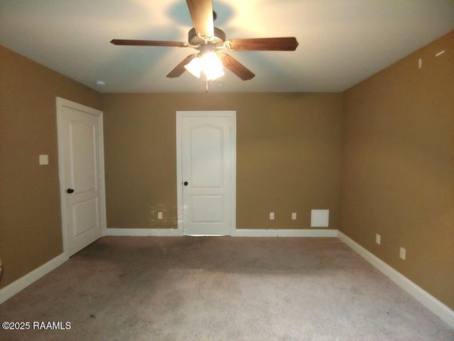 120 Acacia Ln, Abbeville, LA 70510 - carpeted empty room featuring a ceiling fan and baseboards