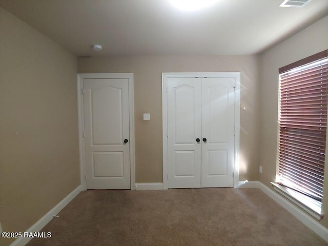 120 Acacia Ln, Abbeville, LA 70510 - unfurnished bedroom featuring carpet flooring and a closet