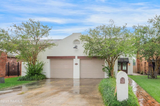 115 Breckenridge Loop, Lafayette, LA 70506 - view of front of house featuring driveway and stucco siding