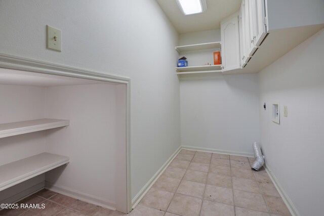 115 Breckenridge Loop, Lafayette, LA 70506 - laundry area with hookup for an electric dryer, cabinet space, washer hookup, and light tile patterned floors