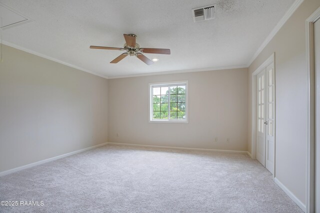 115 Breckenridge Loop, Lafayette, LA 70506 - unfurnished bedroom with carpet floors, crown molding, attic access, a ceiling fan, and a textured ceiling