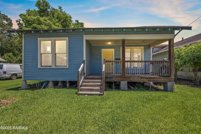 617 E Vermillion St, Lafayette, LA 70501 - back of property featuring a porch and a yard