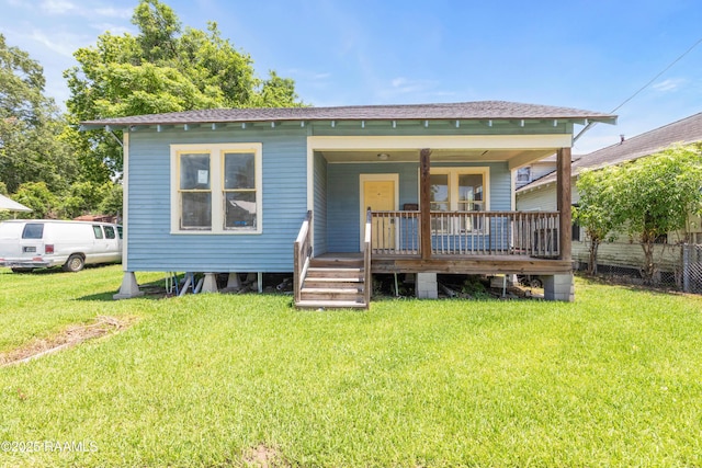 617 E Vermillion St, Lafayette, LA 70501 - back of house featuring a porch and a shingled roof