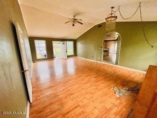 1627 Daniel St, Abbeville, LA 70510 - unfurnished room with wood finished floors, vaulted ceiling, and arched walkways