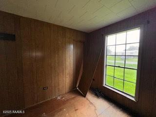 1627 Daniel St, Abbeville, LA 70510 - unfurnished room with healthy amount of natural light and wooden walls