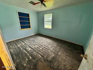 1627 Daniel St, Abbeville, LA 70510 - unfurnished room with a ceiling fan, brick flooring, and built in features