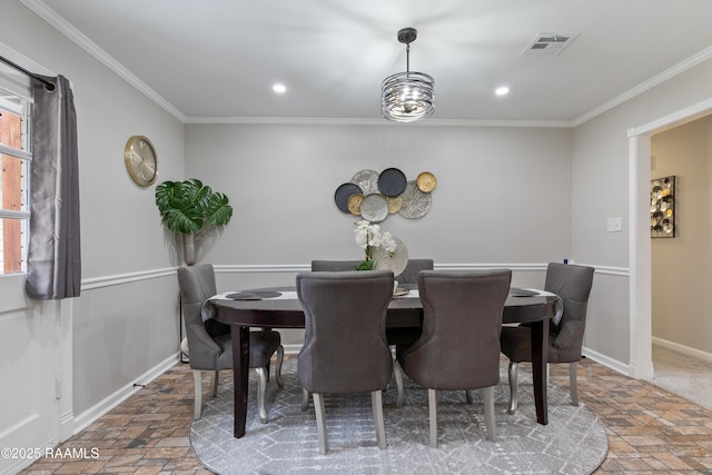 809 Dartez Dr, New Iberia, LA 70563 - dining area with stone tile flooring, crown molding, and recessed lighting