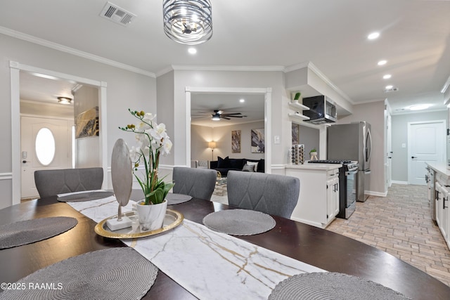 809 Dartez Dr, New Iberia, LA 70563 - dining area with crown molding, recessed lighting, and ceiling fan