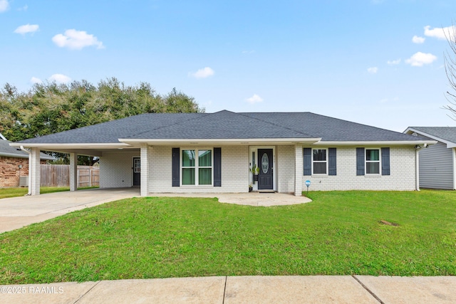 809 Dartez Dr, New Iberia, LA 70563 - single story home featuring driveway, an attached carport, a shingled roof, and brick siding
