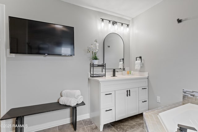 809 Dartez Dr, New Iberia, LA 70563 - bathroom featuring vanity and a relaxing tiled tub