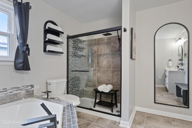 809 Dartez Dr, New Iberia, LA 70563 - full bathroom featuring vanity, a stall shower, a garden tub, and tile patterned flooring