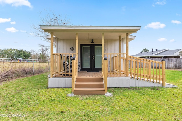 809 Dartez Dr, New Iberia, LA 70563 - view of outdoor structure featuring french doors and a fenced backyard