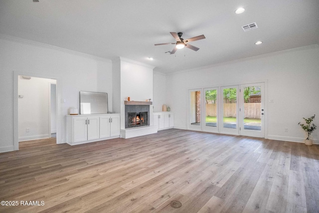 806 Beaujolais Pkwy, Lafayette, LA 70503 - unfurnished living room featuring crown molding, ceiling fan, a lit fireplace, light wood-type flooring, and recessed lighting